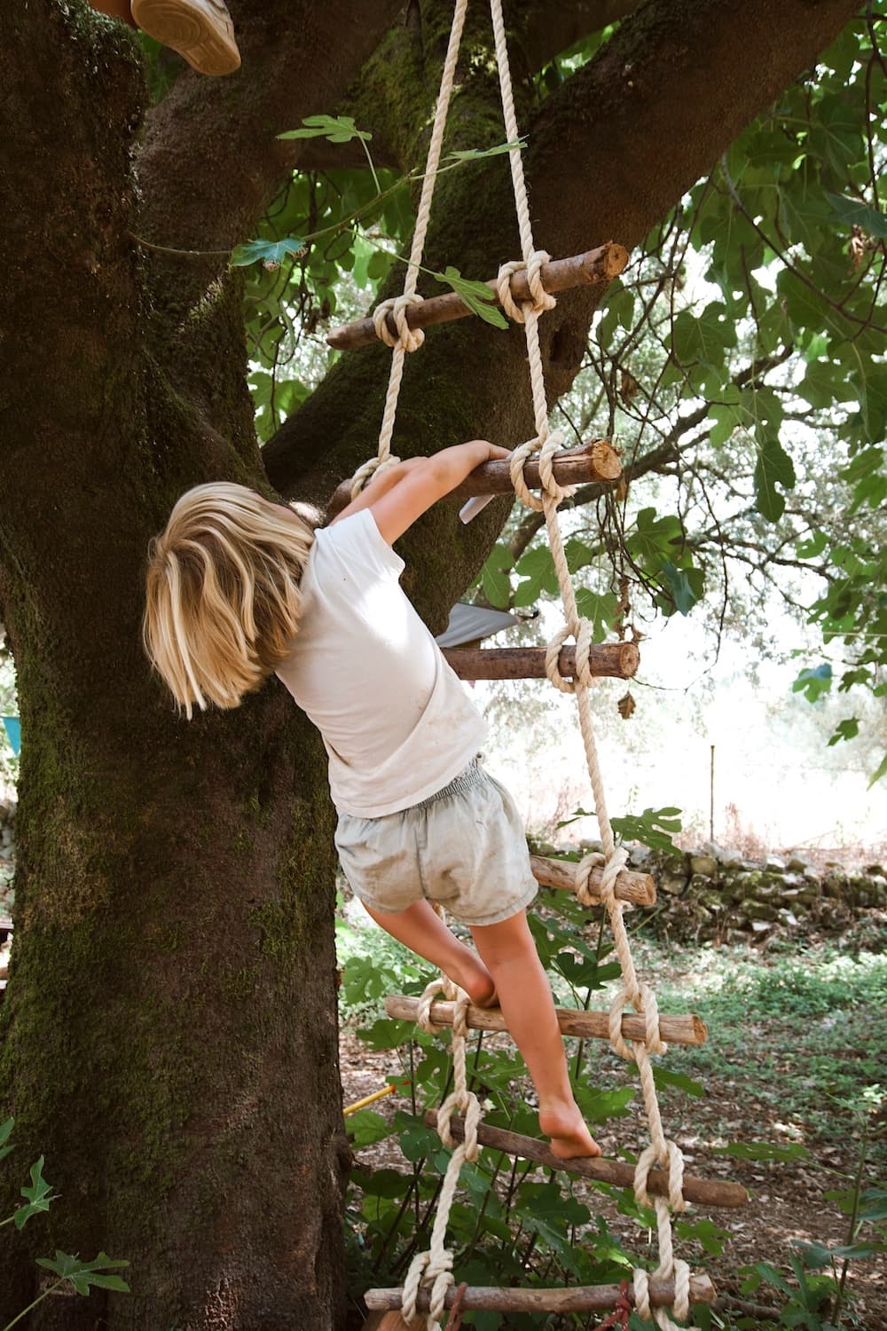 girl climbing ladder
